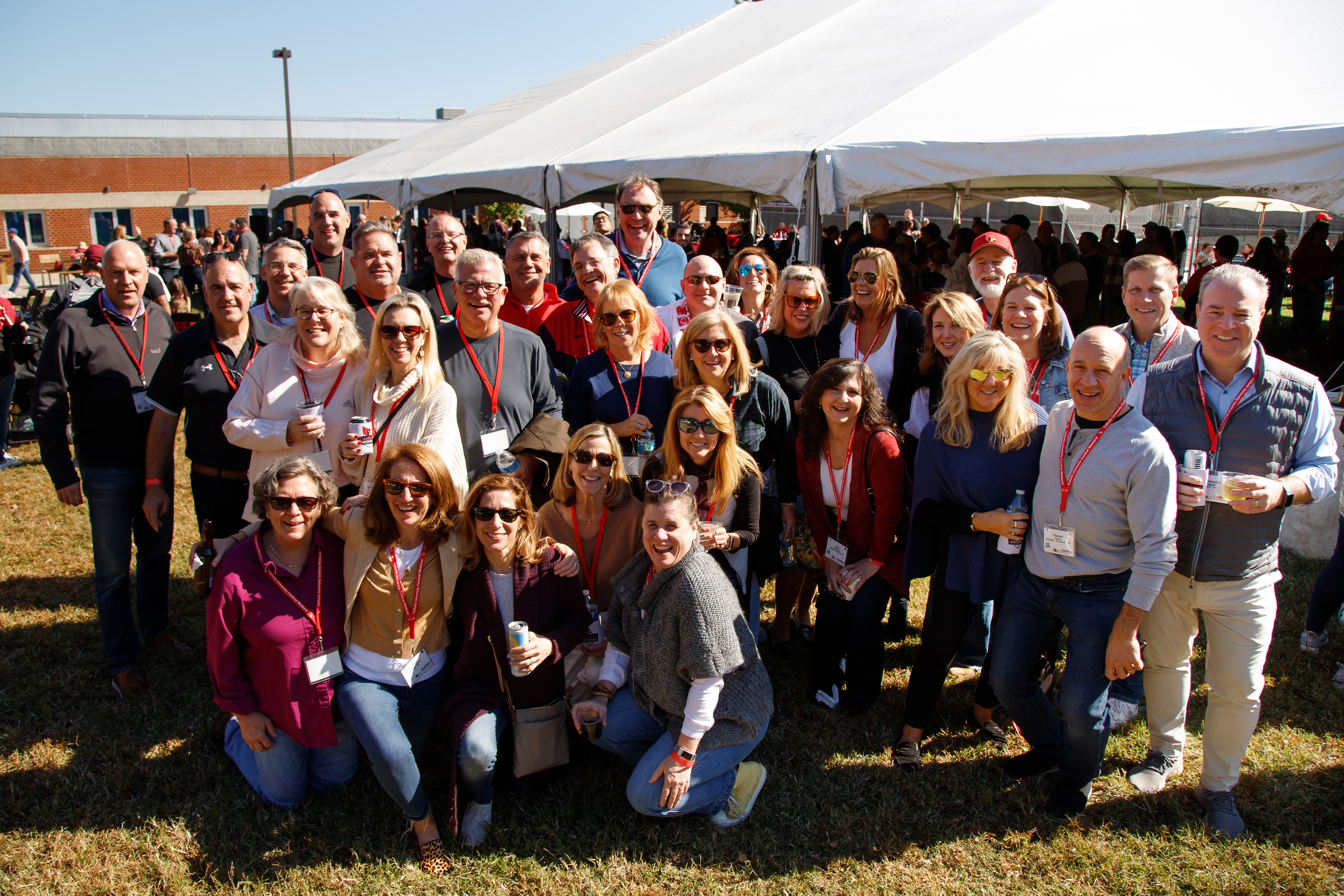 Group of Alumni posed at tent party