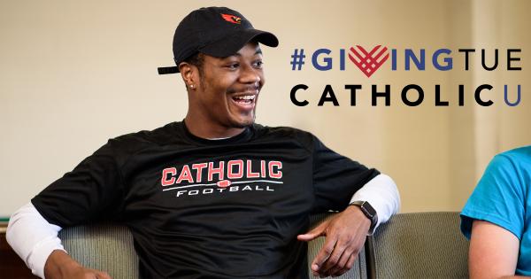 Catholic University student with Giving Tuesday logo