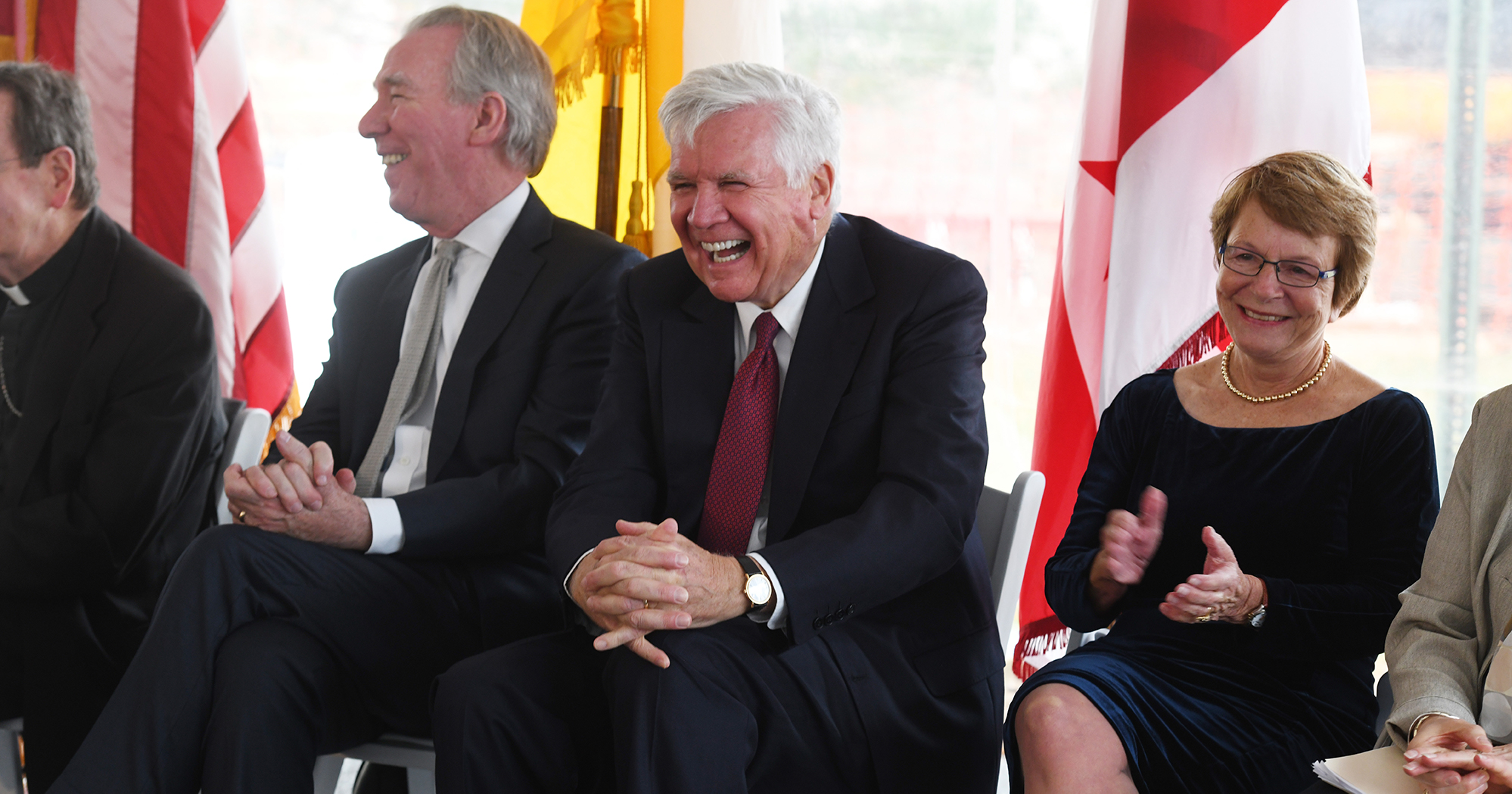 Bill Conway laughs, with President Garvey and Dean Emerita McMullen by his side