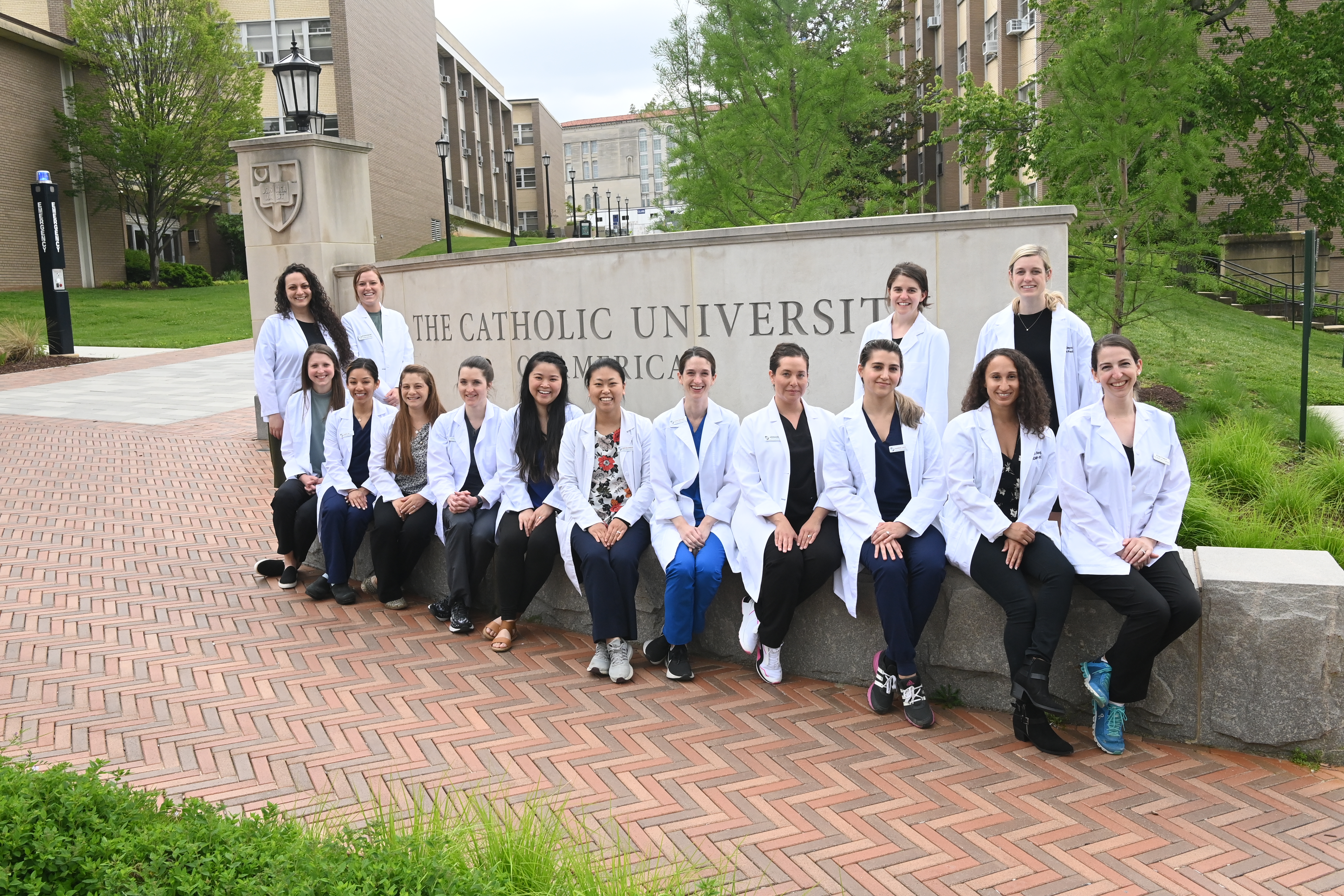 Nursing students posed at Catholic University sign