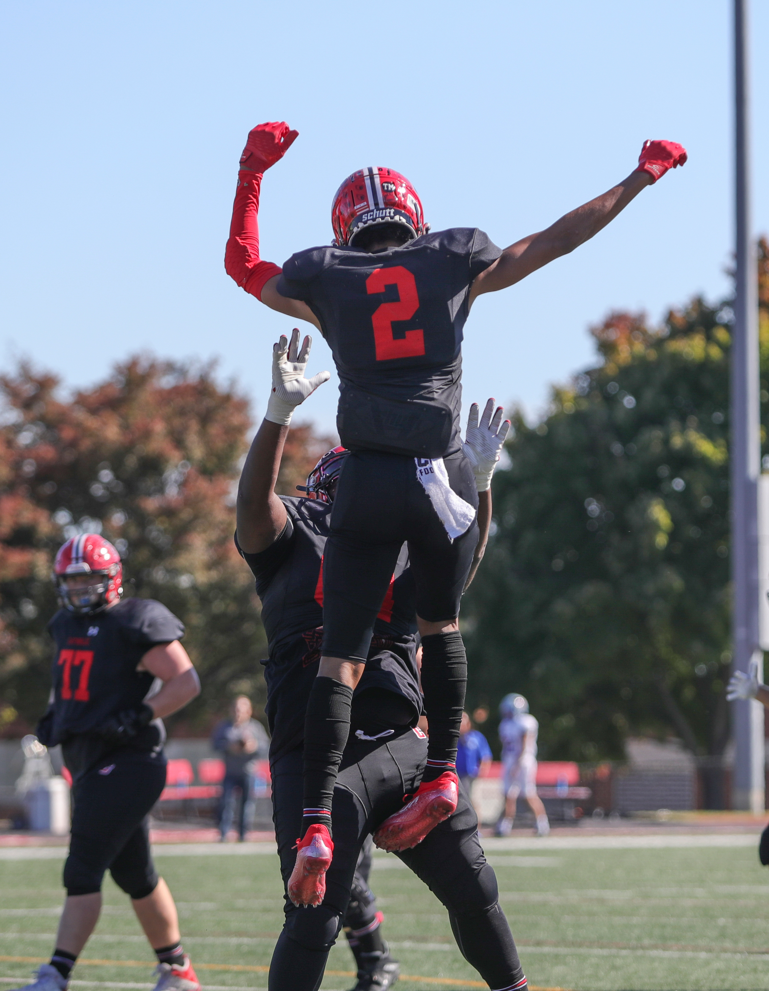 Football players celebrating a touchdown