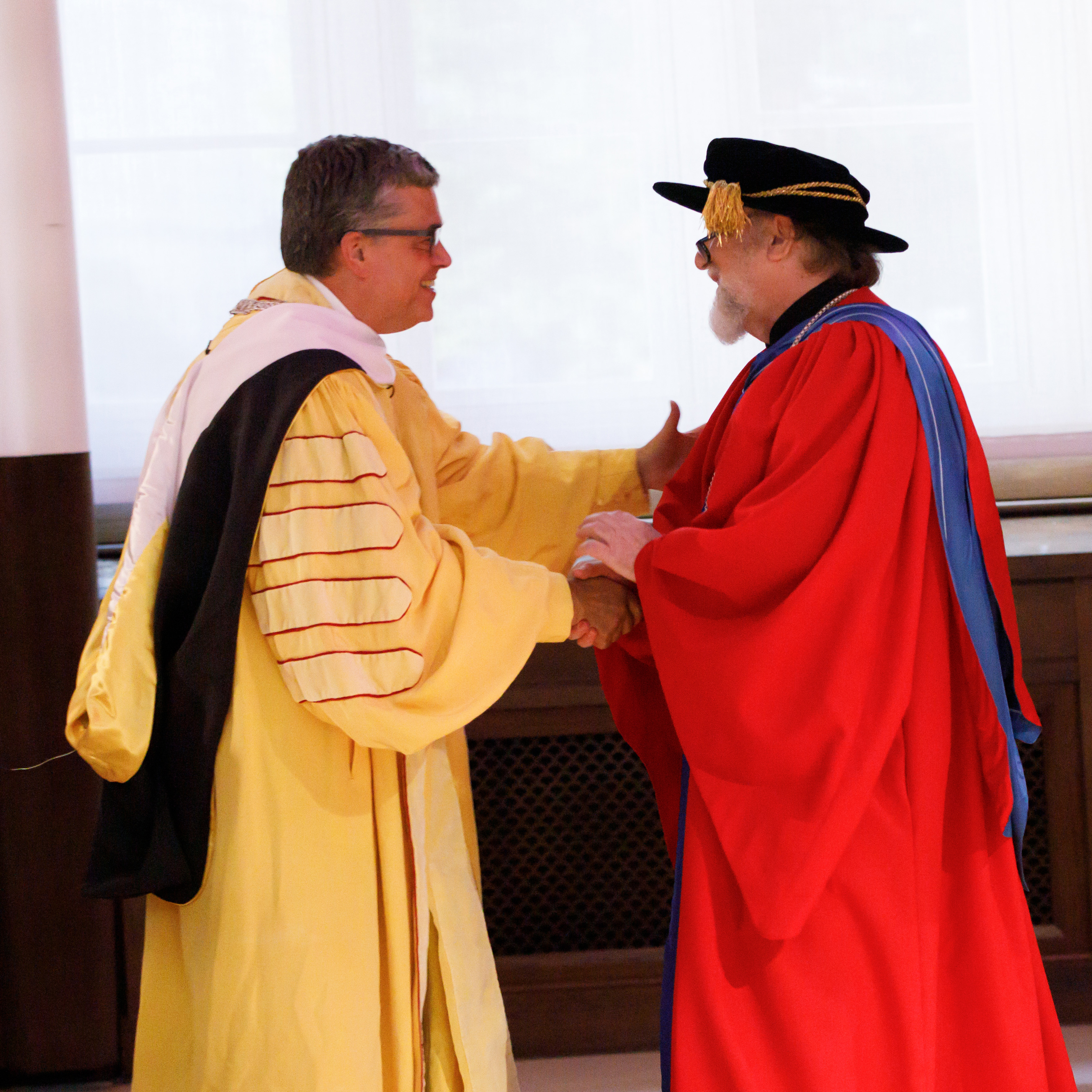President Kilpatrick shaking hands with Fr. Peter Galadza