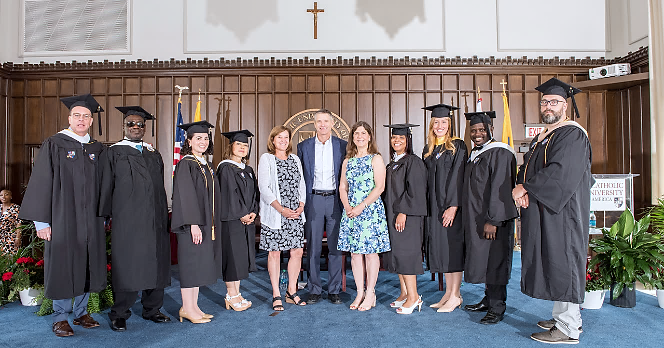 Sheehy family poses with graduates