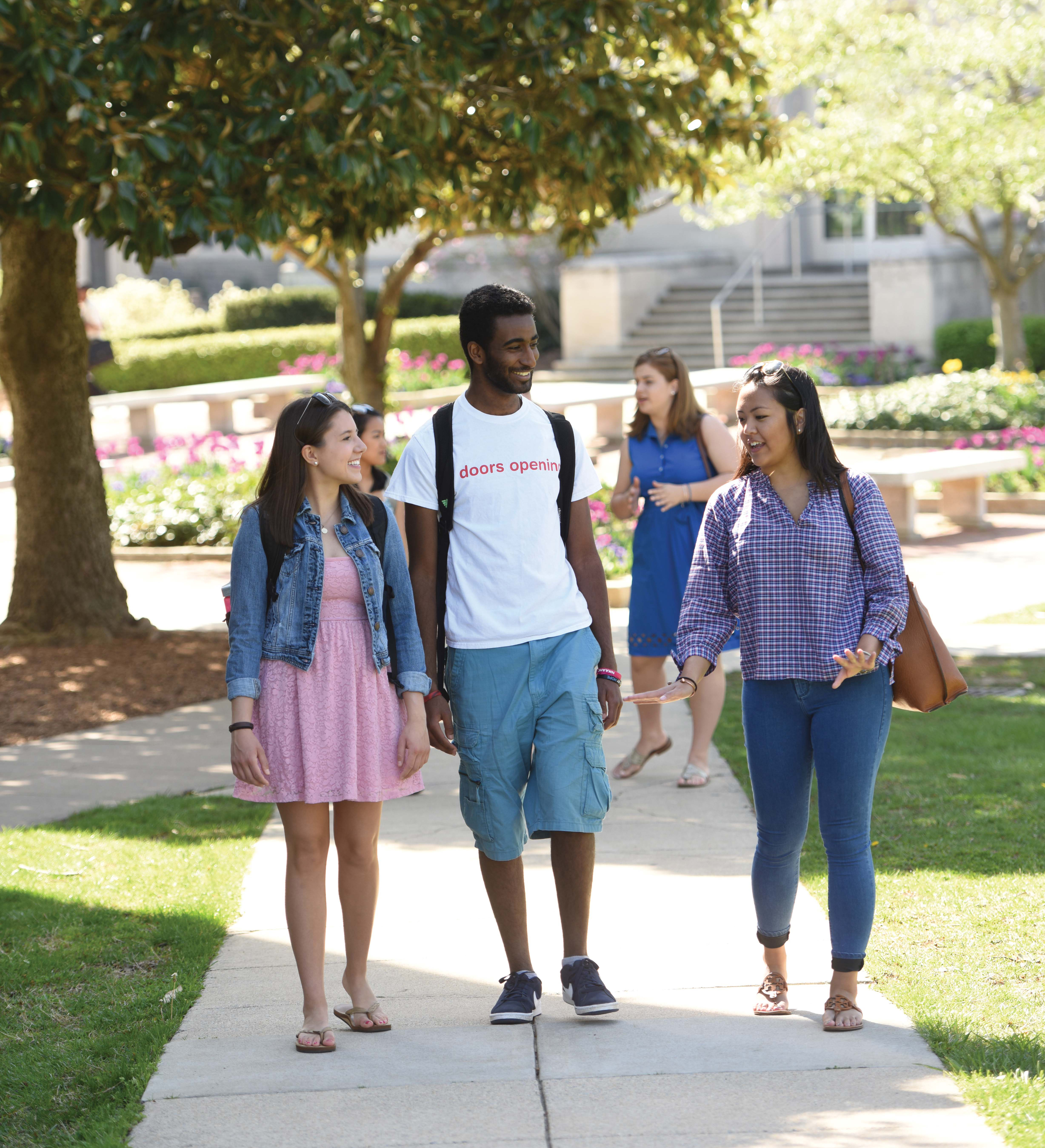 Students walking on campus in the fall