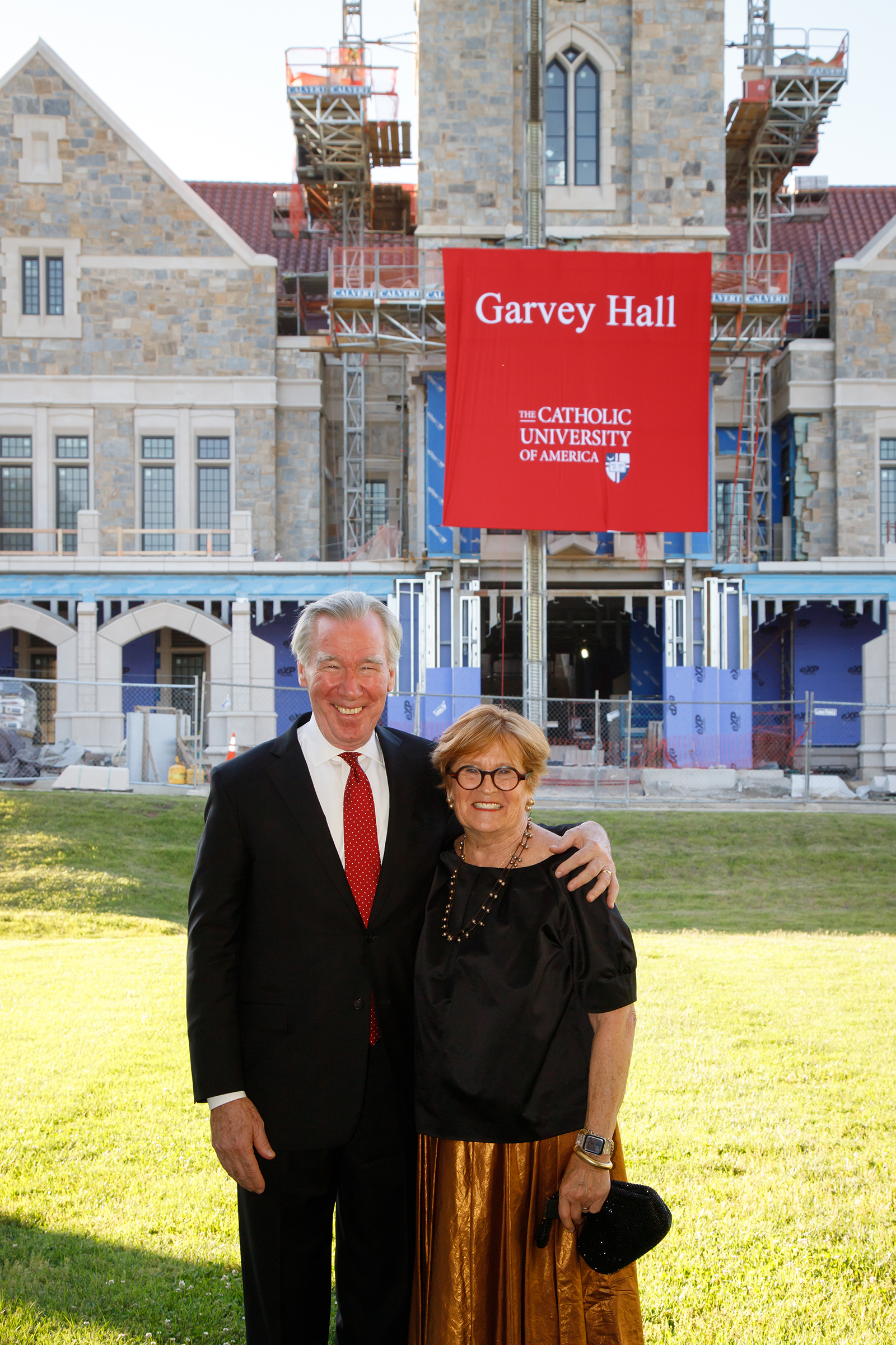 John and Jeanne Garvey with the Garvey Hall banner