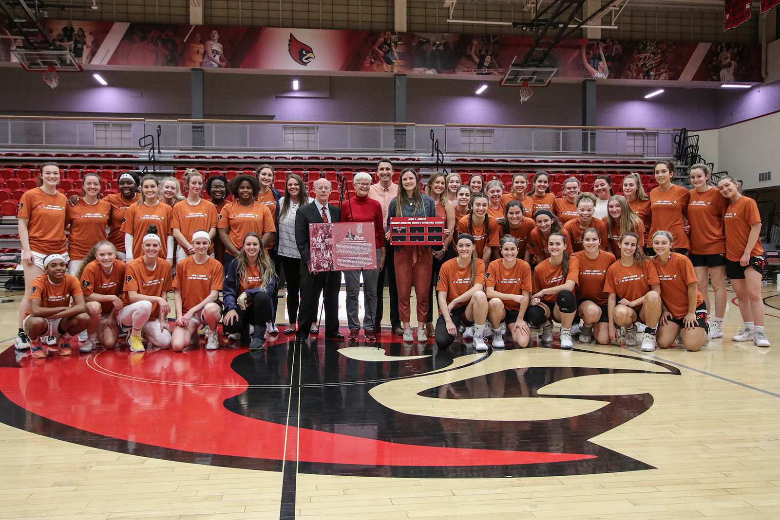 Bridget Power and Bob Roberts with the women's basketball team