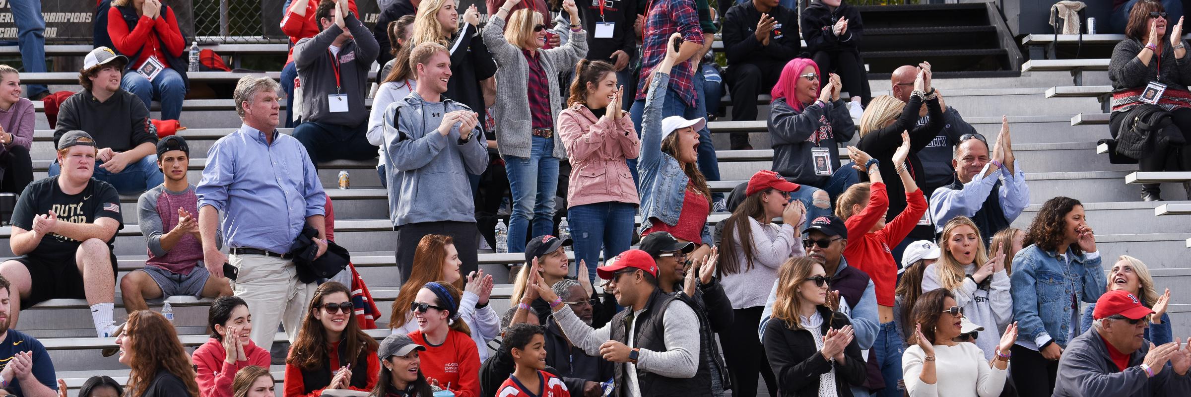 Fans cheer from the Cardinal Stadium stands