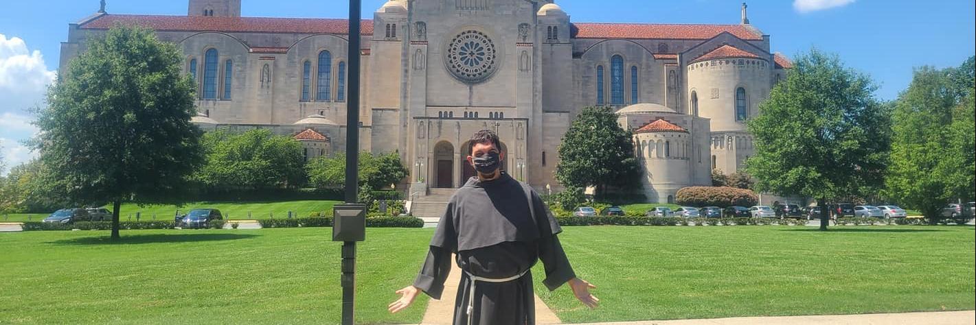 Franciscan friar in front of the Basilica