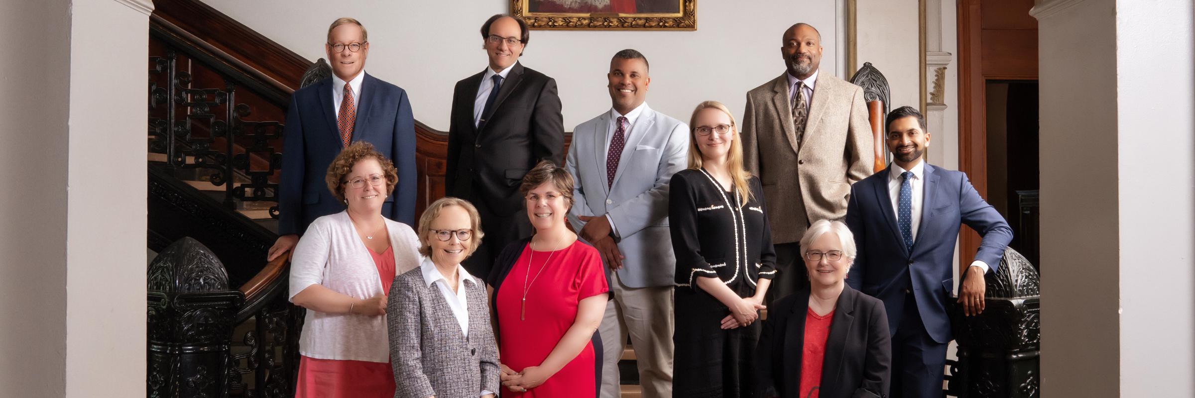 Faculty stand in McMahon Hall