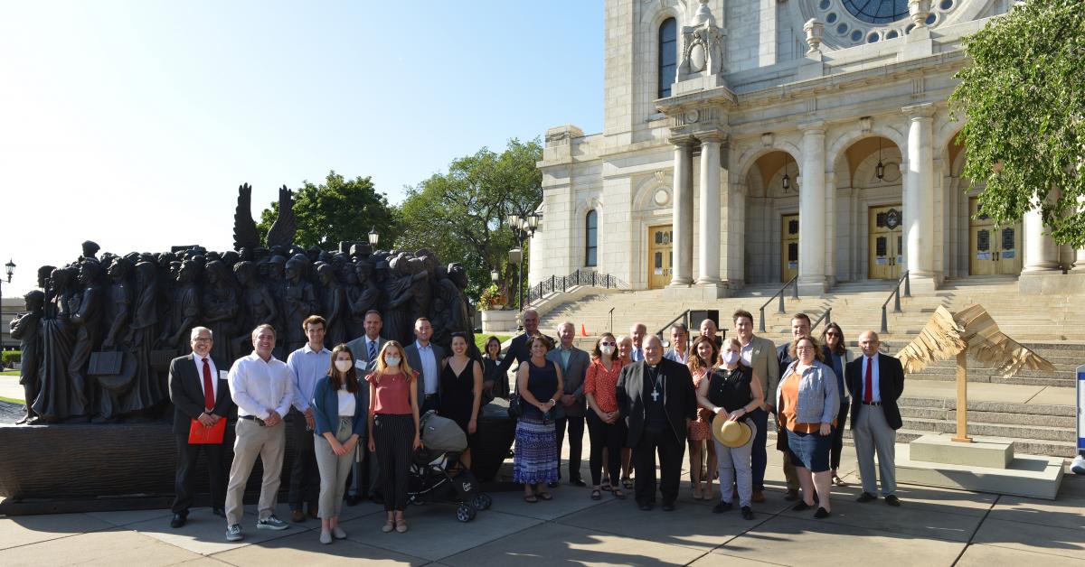 CatholicU alumni and donors in front of Angels Unawares