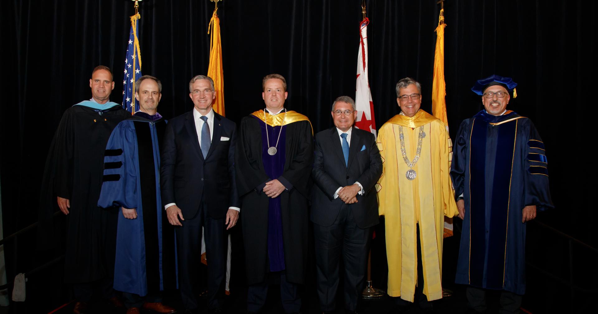 Kevin Walsh poses with President Peter Kilpatrick, University trustees, and administrators